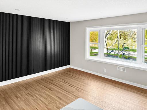 Living room with striking black slat accent wall