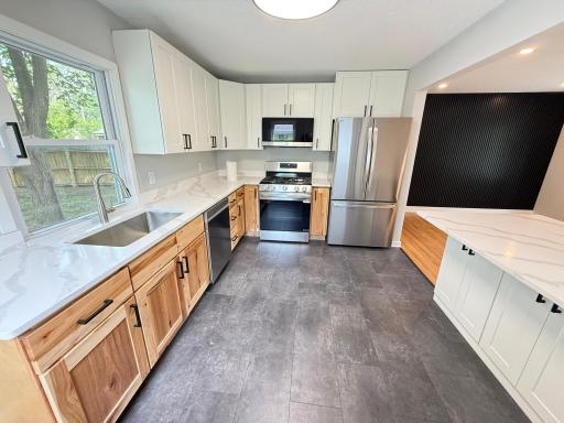 Brand new kitchen with quartz countertops and new cabinetry