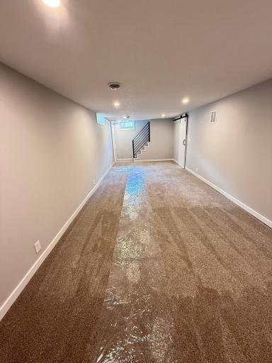 Spacious renovated lower level offers flexible living space and expansion potential