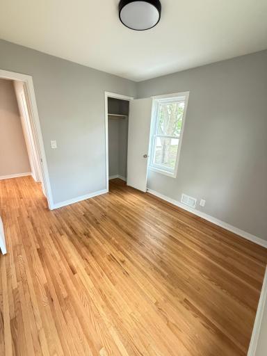 Second bedroom with natural light and updated finishes