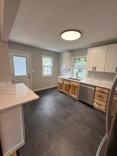 Bright kitchen with backyard views and updated finishes throughout