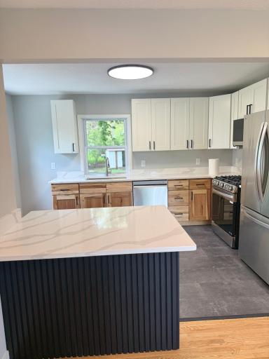 Peninsula island adds prep space, seating, and open-concept flow