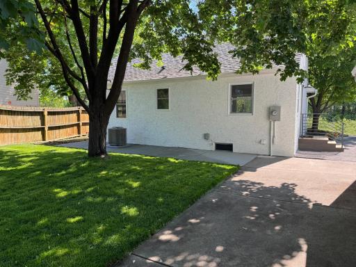 Large fenced backyard with mature trees and room to enjoy