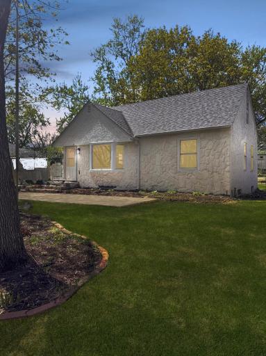 Elevated lot with mature trees and fresh landscaping