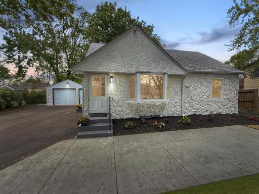 Fresh exterior paint, updated entry, and convenient driveway access