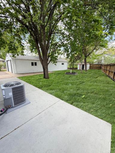 Backyard patio with easy access to garage and outdoor space