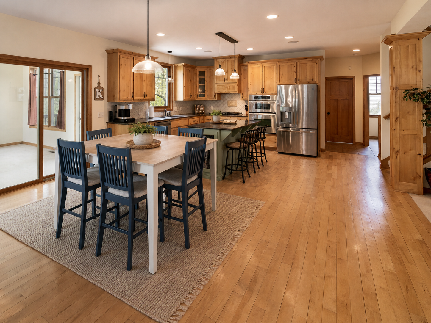 Informal dining area is open to kitchen and leads to a 4-season porch.