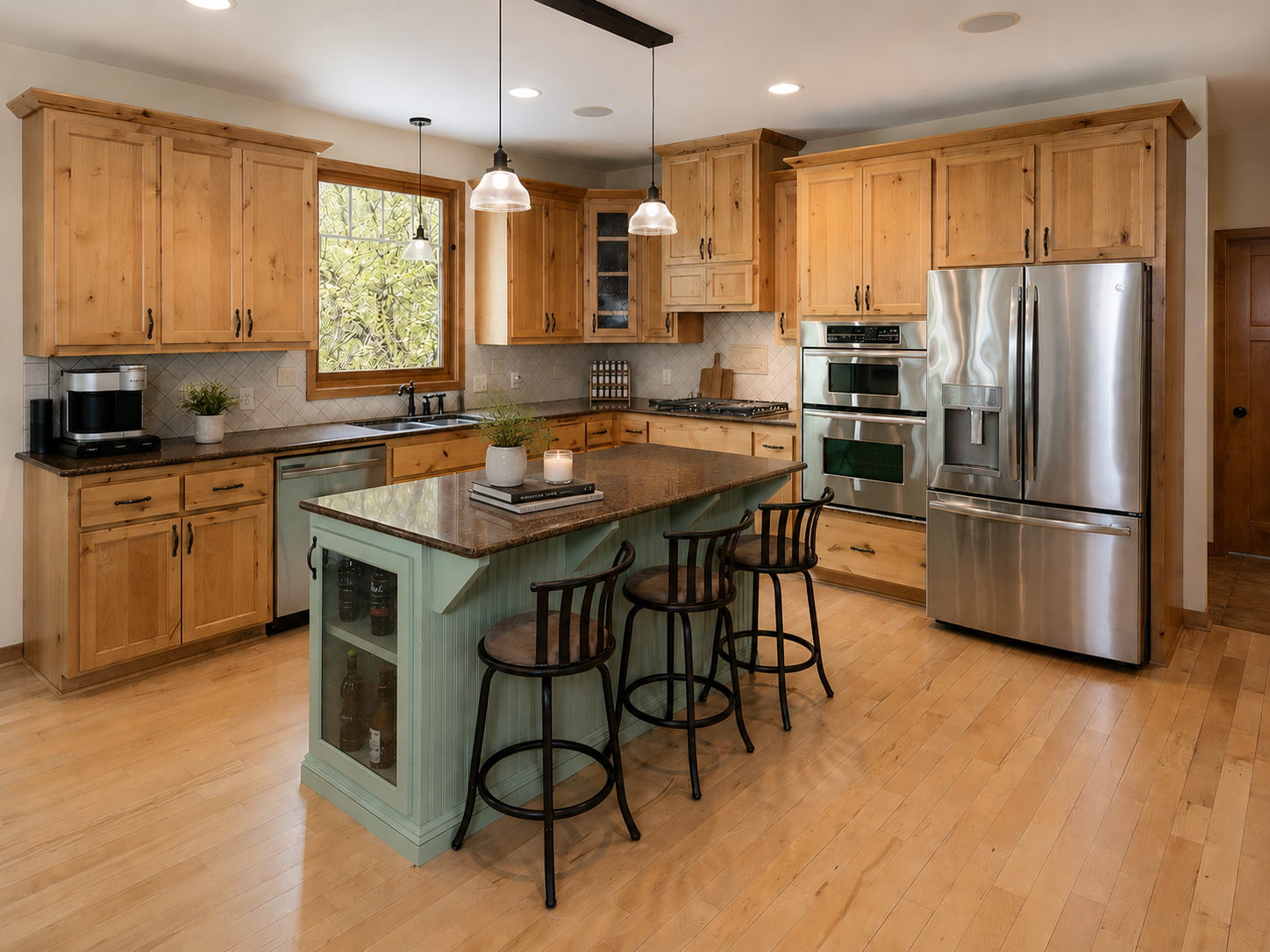 Gourmet kitchen with custom knotty Alder cabinets, Cambria countertops and 42" uppers.