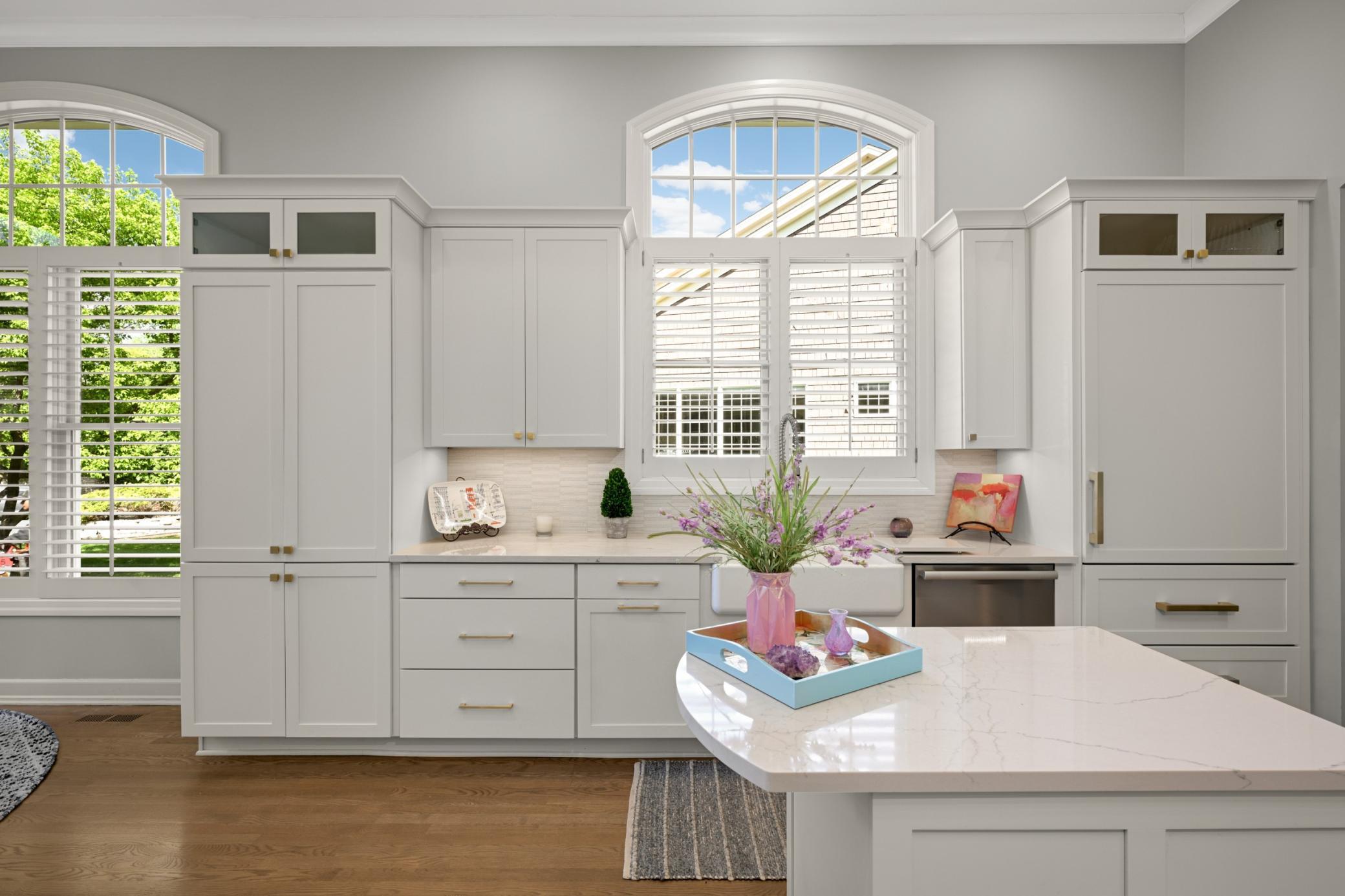 High arched windows with plantation shutters