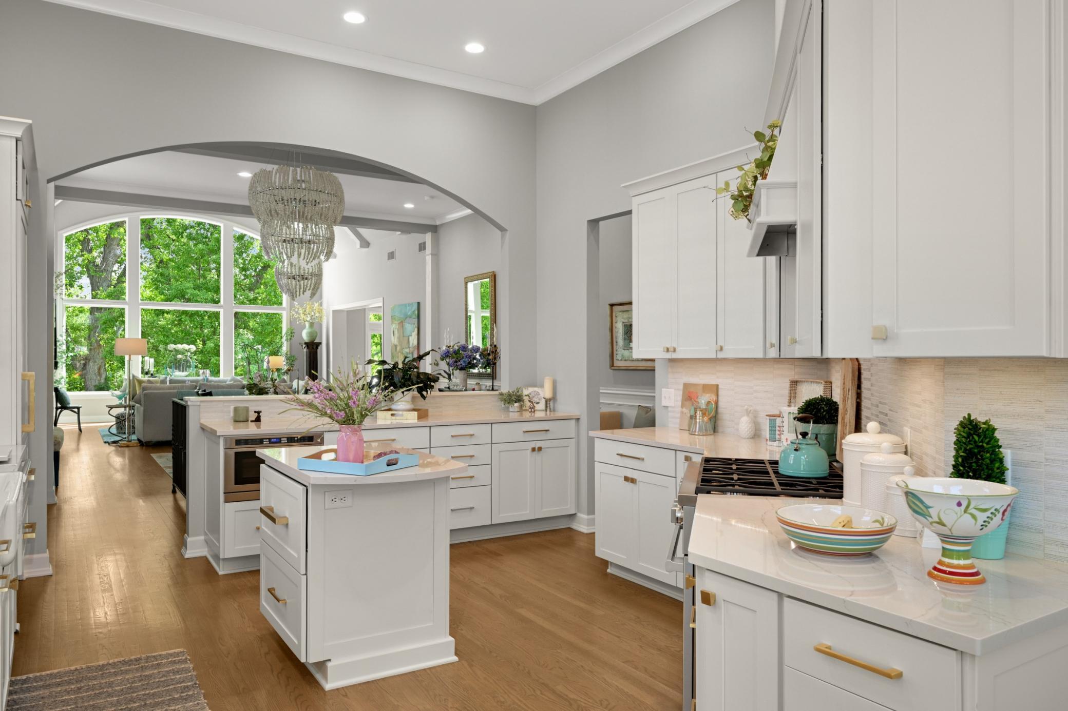 The large kitchen wall has been opened to capture the view