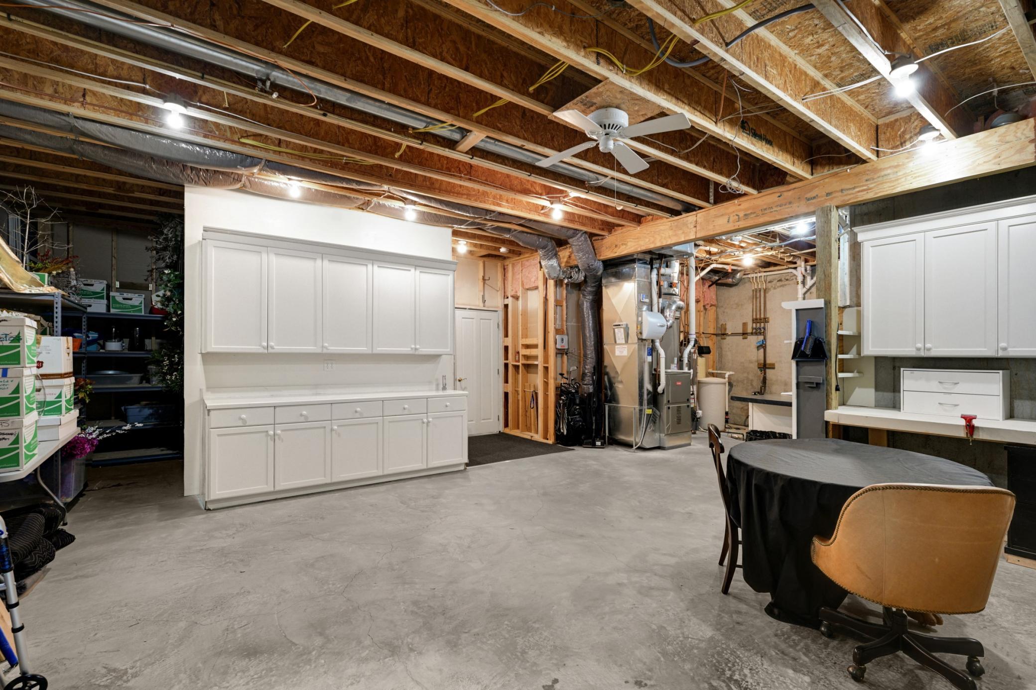 There is an enormous storage/ workshop room