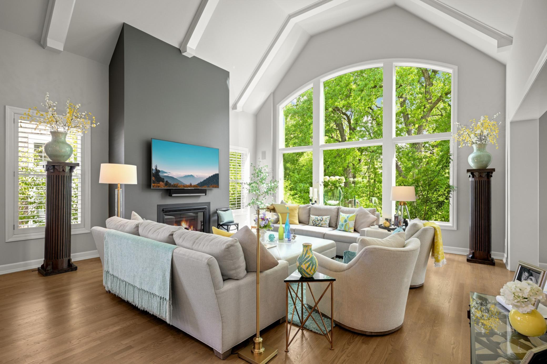 the great room, you’ll be cinched by the handsome gas fireplace and cathedral beamed ceilings