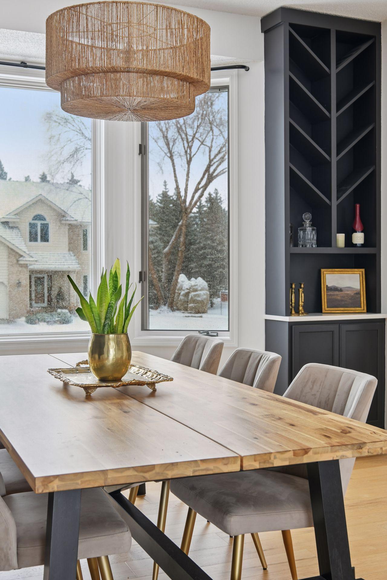 Large windows flood the dining room with natural light, creating an inviting atmosphere from brunch to candlelit evenings.