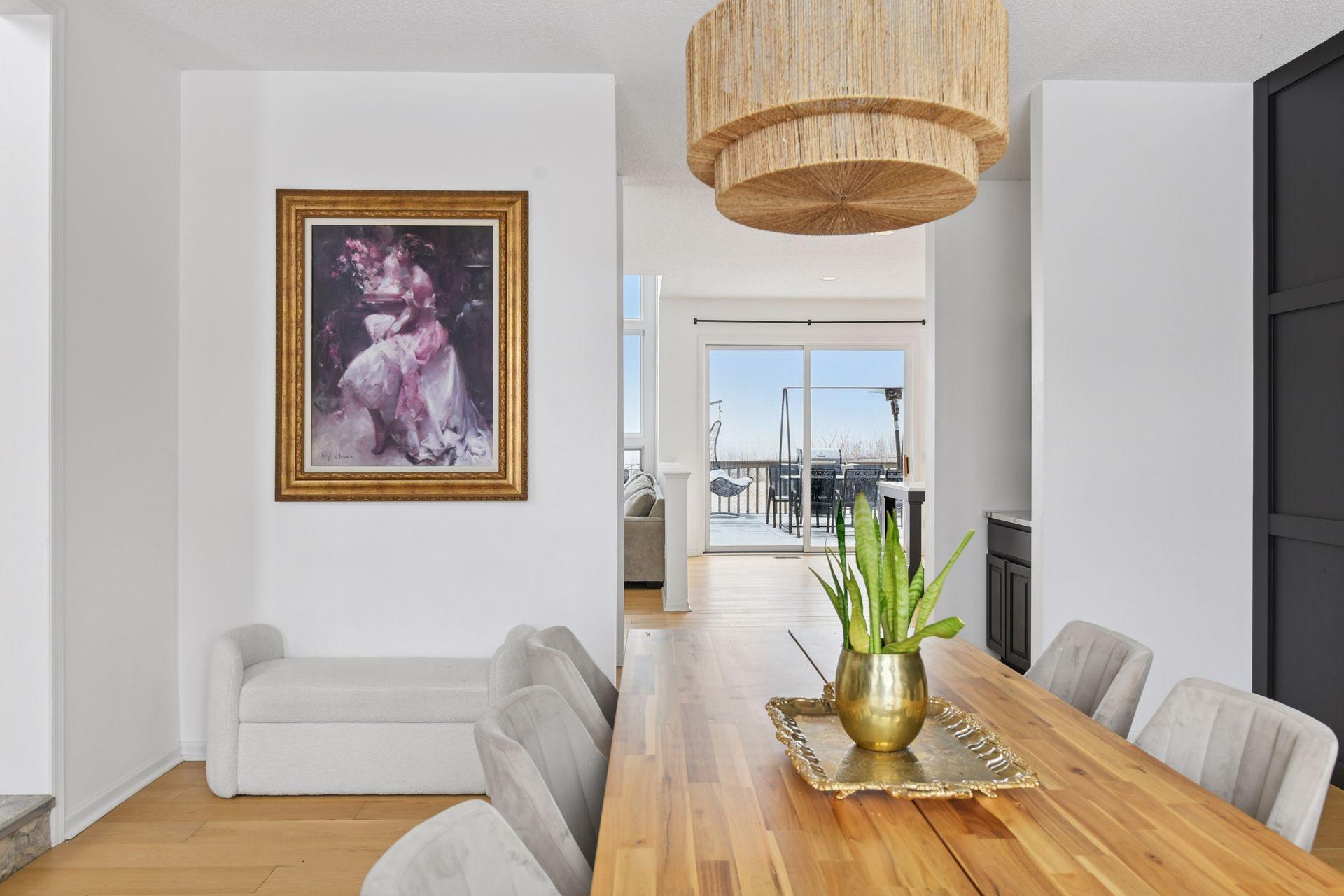 From each level, the home unfolds into expansive gathering areas that feel both dramatic and traditionally refined.