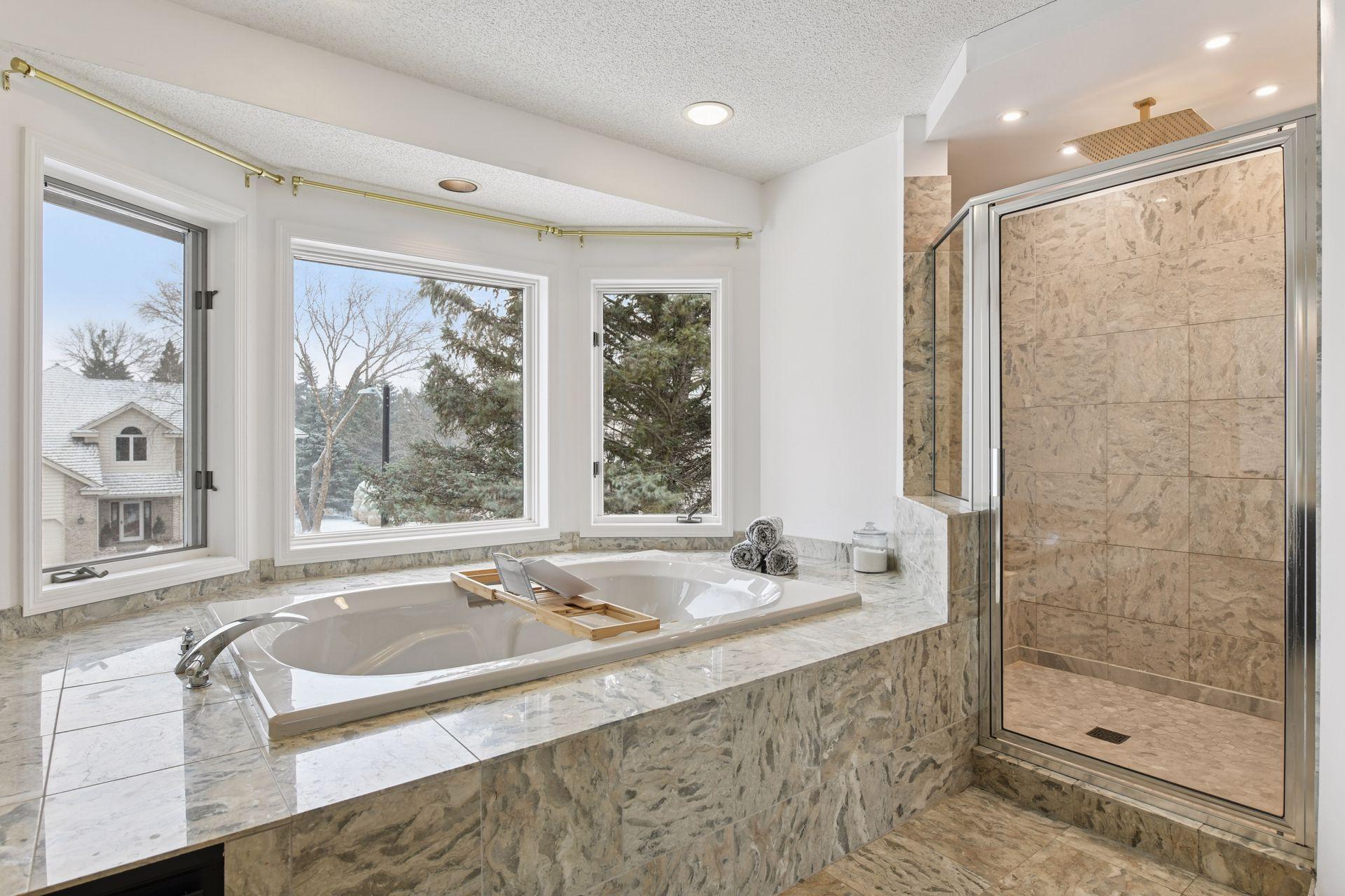 Featuring a deep soaker tub, rain shower, and elevated finishes — a serene retreat designed for restoration and comfort.