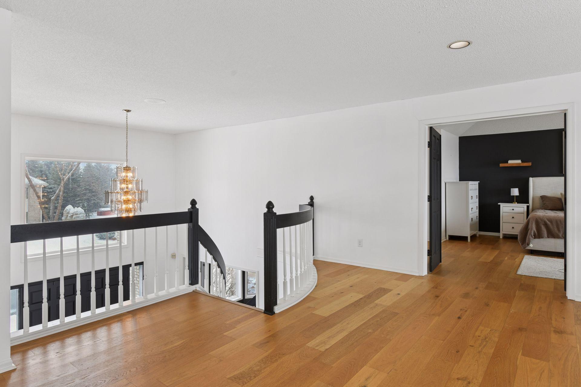 Newer light wood flooring enhances the home with natural warmth, subtle texture, and elevated continuity throughout the main level.