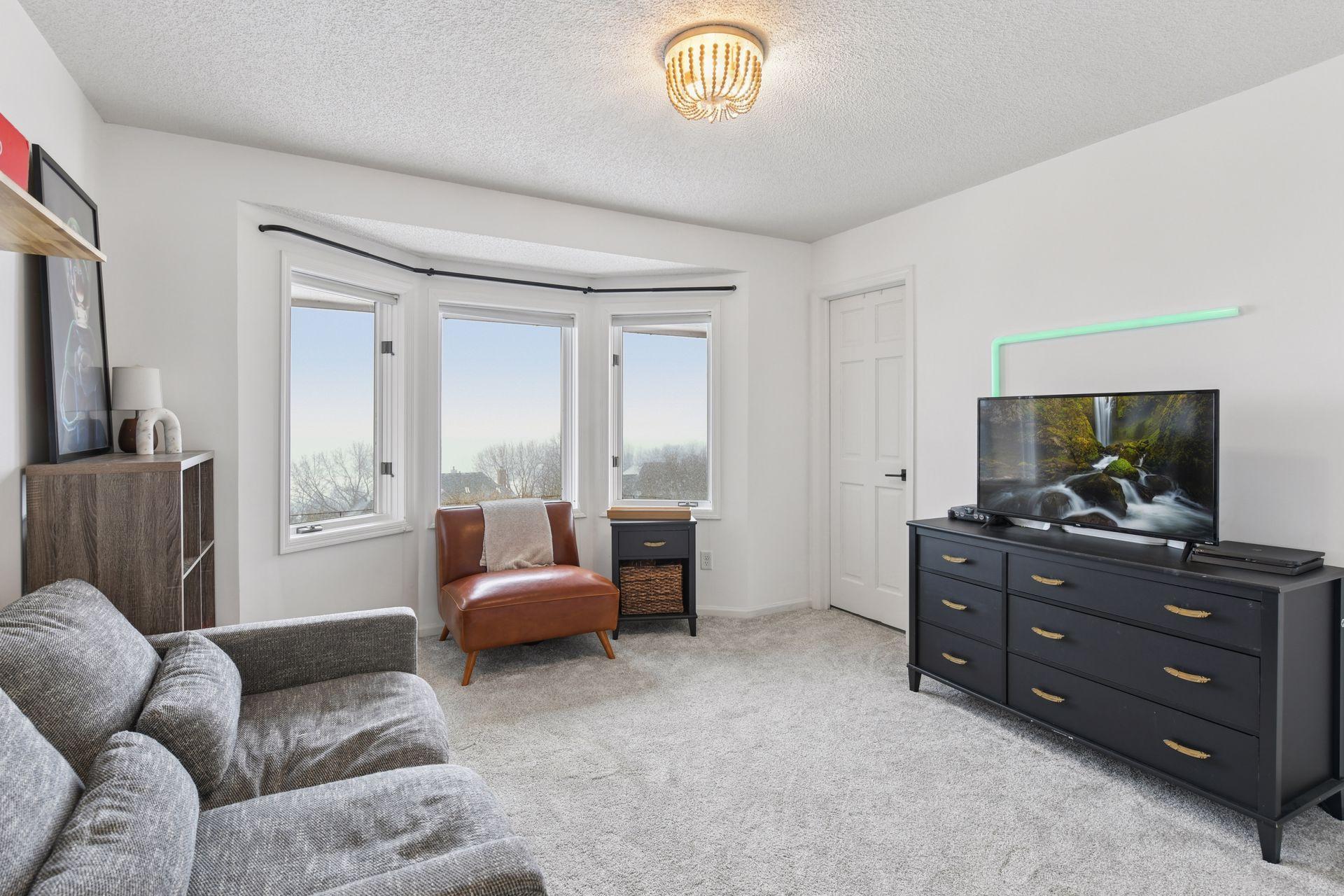 Second of the four bedrooms upstairs, this room features an en suite 3/4 bathroom with a fantastic view of the back yard.