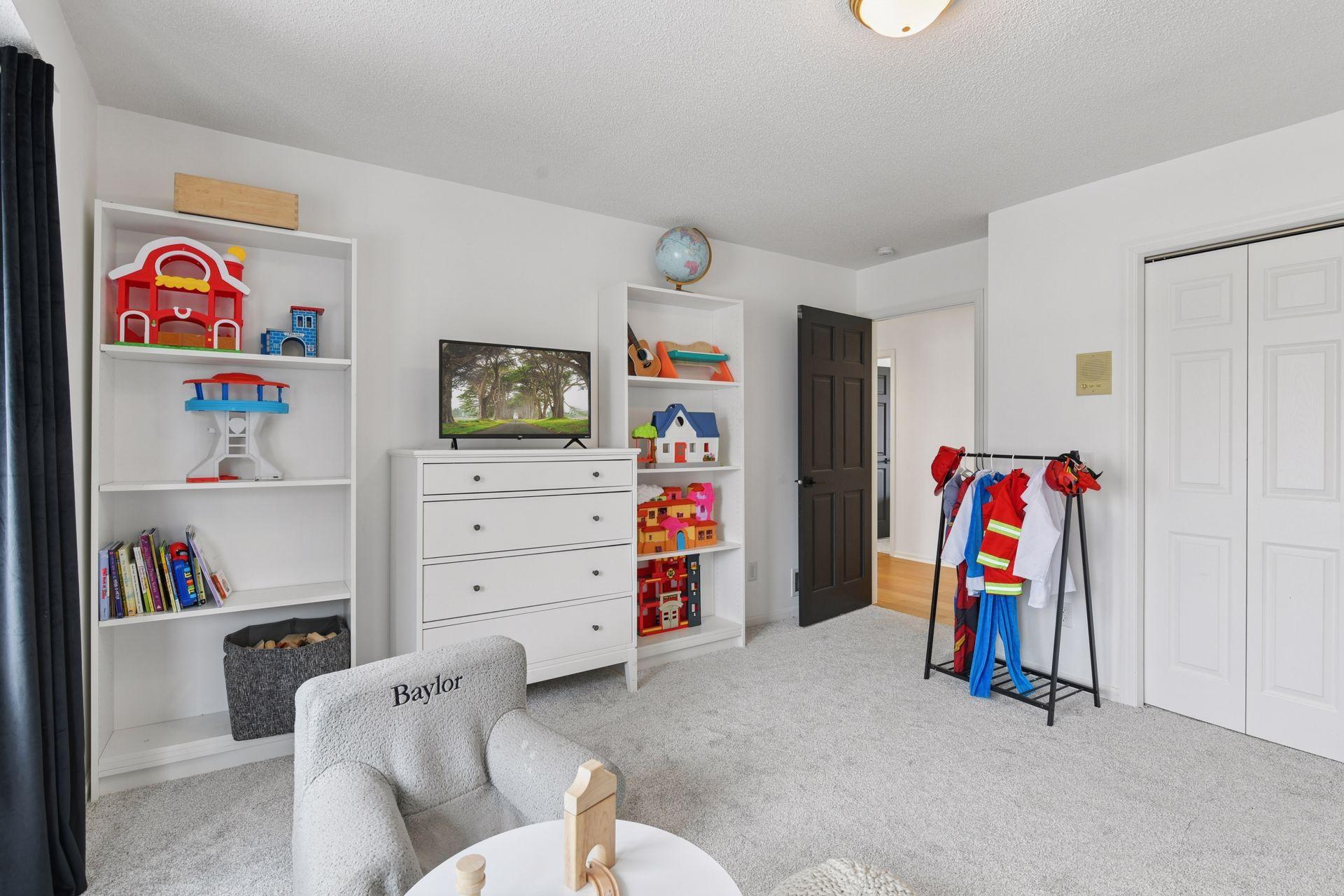 This bedroom could be used as a play room, guest room, upper level office space.