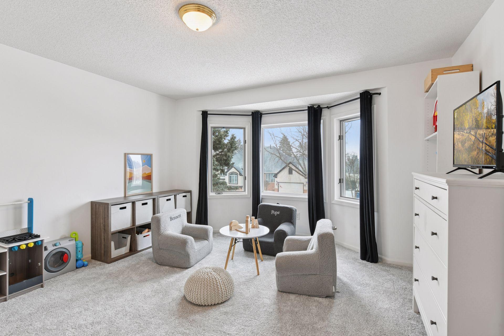 One of four bedrooms located on the upper level, with beautiful cascading natural light.