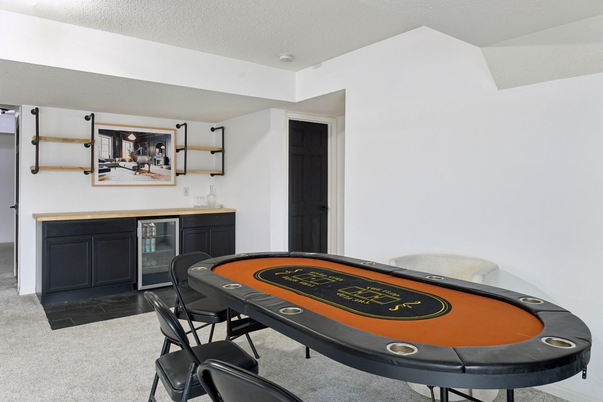 A dedicated card table area invites late-night conversations and friendly rivalry.