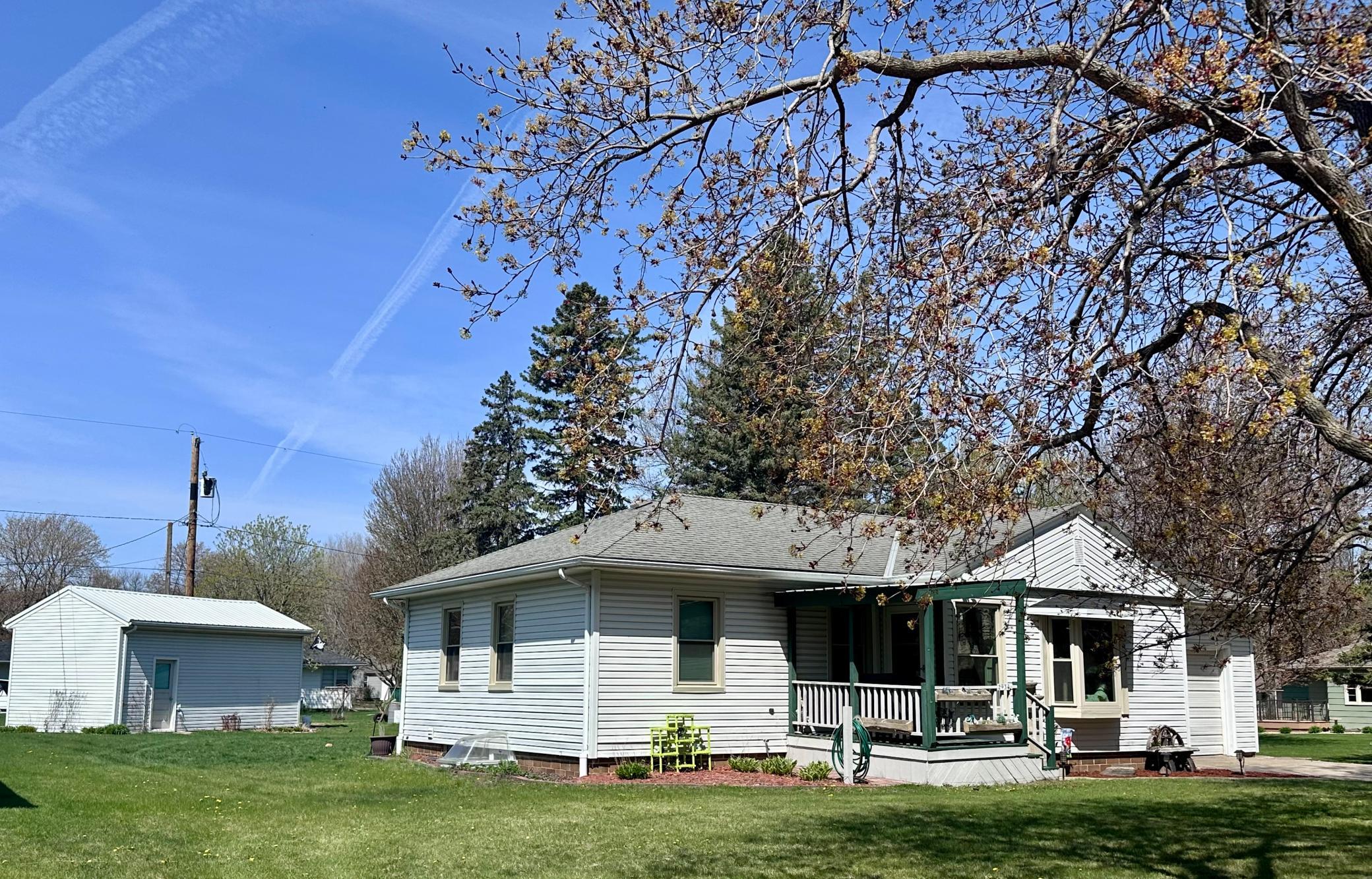 Charming curb appeal with dual garage convenience -- attached & detached for ultimate flexibility.