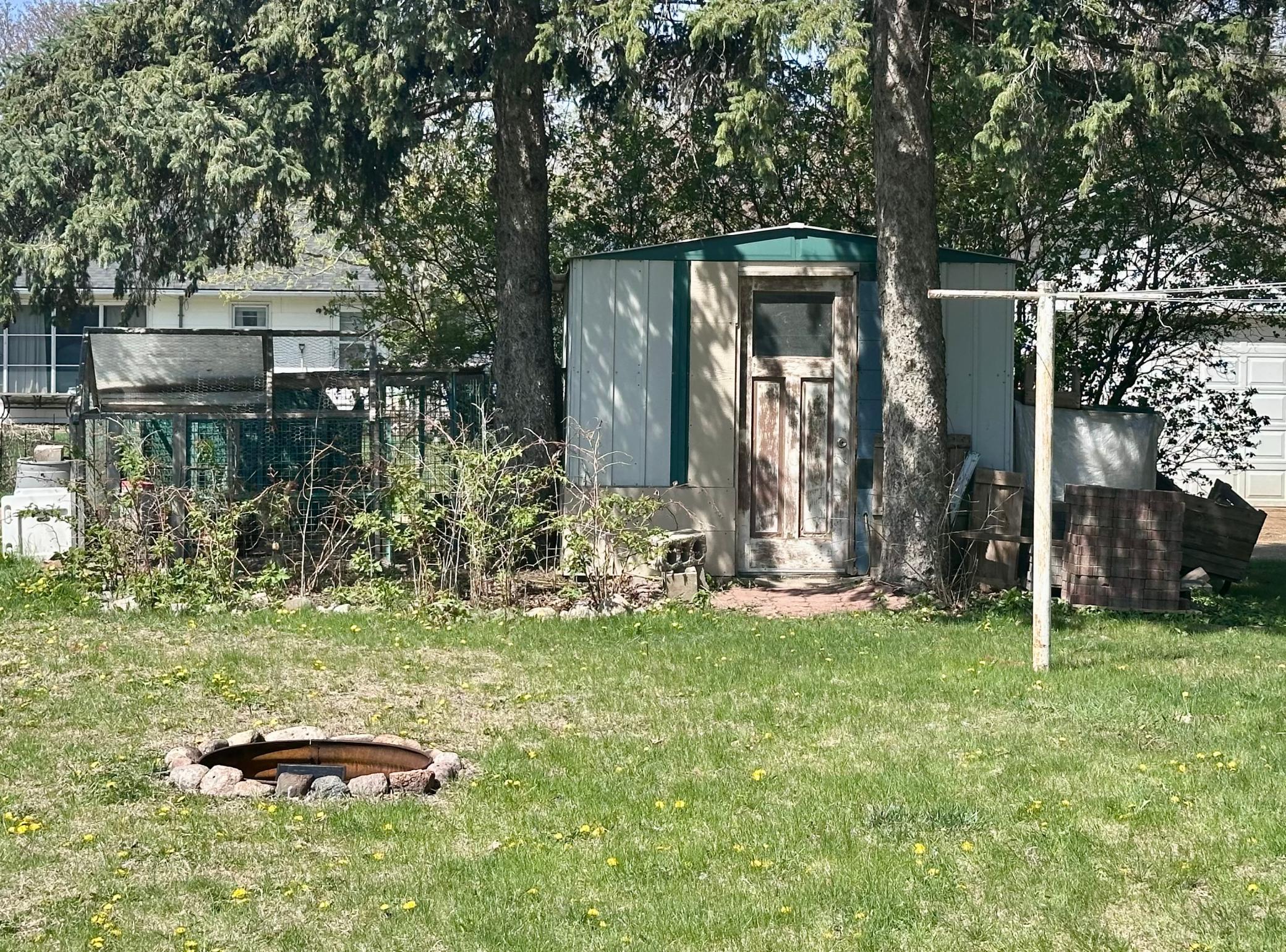 Backyard offers a built-in firepit and a 8 x 10 shed -- NOTE: Chickens and Chicken Coop will NOT stay.