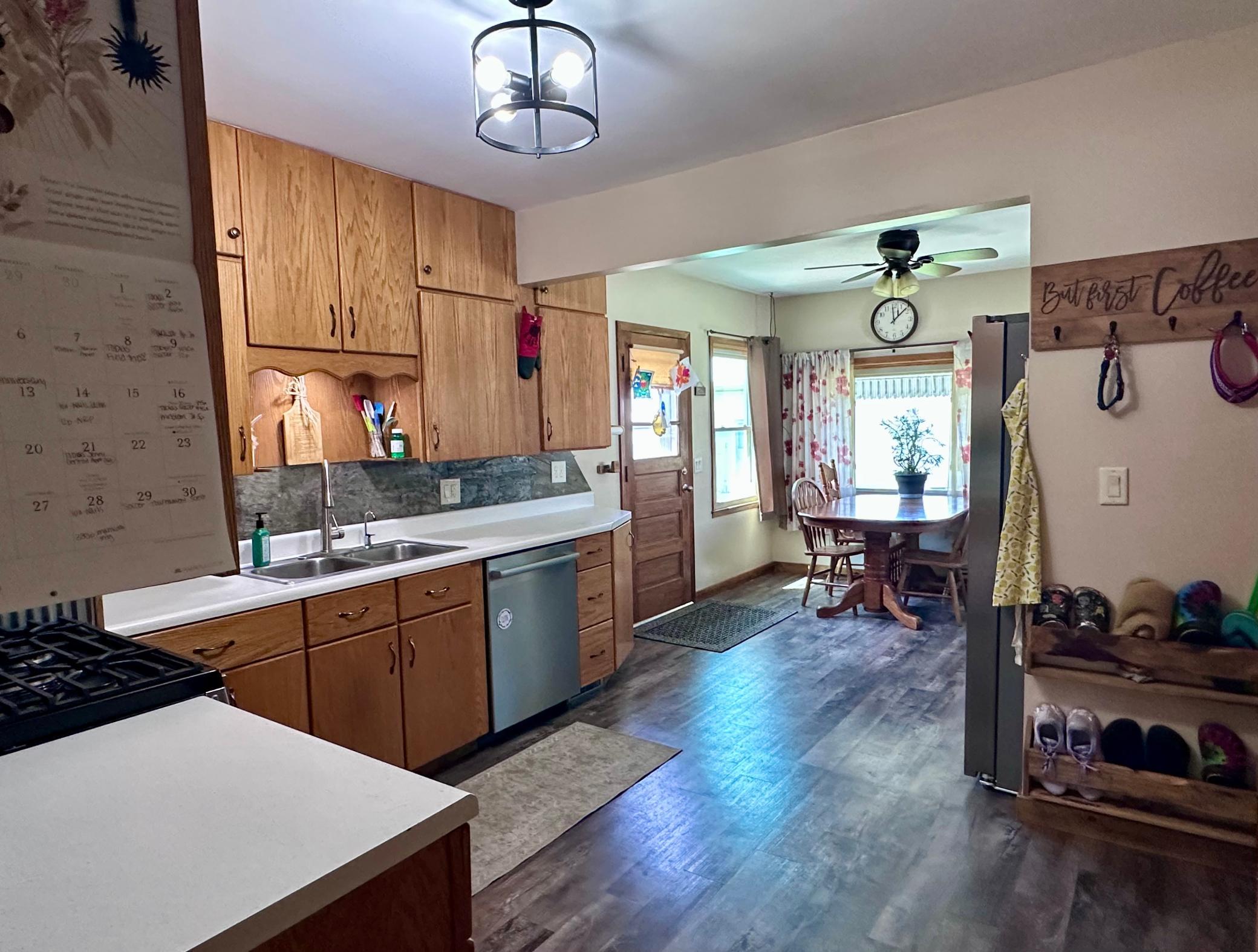 Through the main level living room, you access the kitchen and dining room.