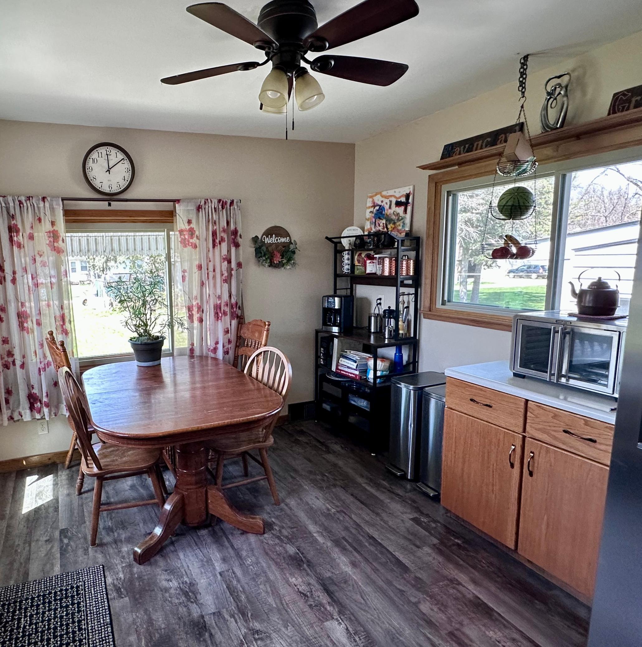 Another closer view of the dining room surrounded by windows for a bright feeling.