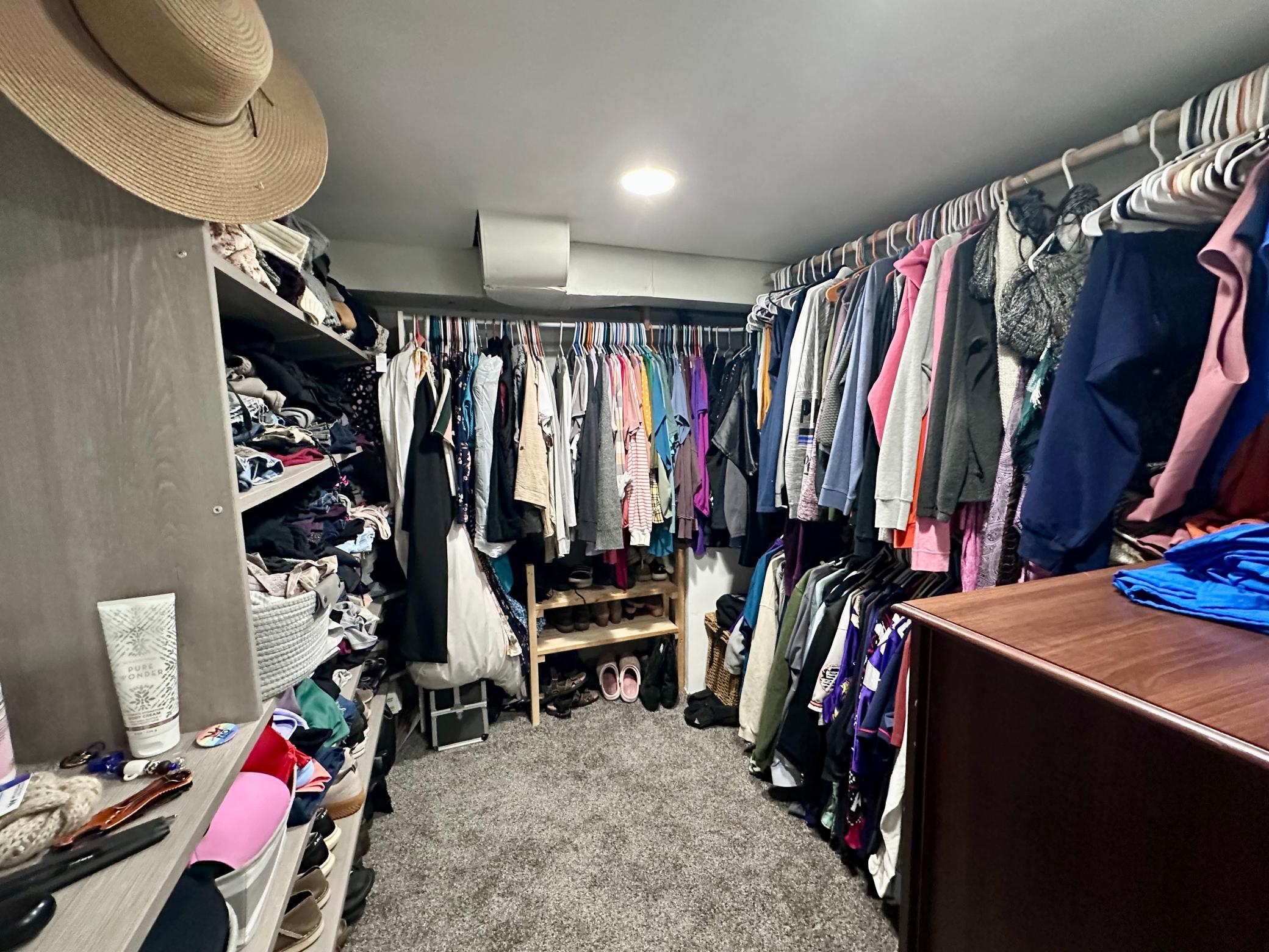 Massive walk-in closet featuring built-ins for all your storage needs.