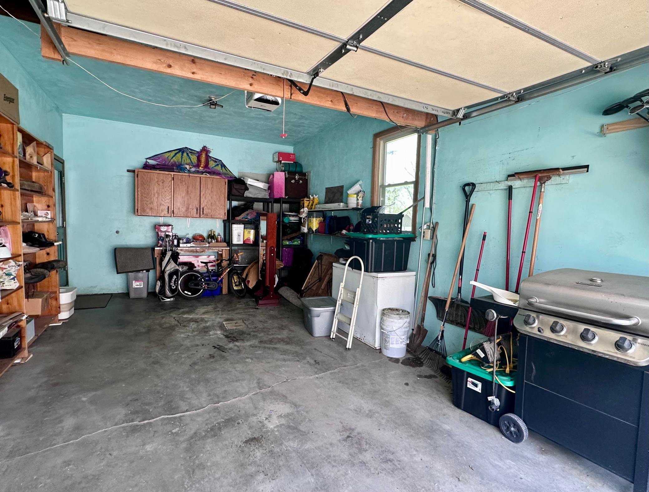 Attached garage allows enough space for a vehicle and surrounding storage - don't forget the detached garage, which is an abundance of storage/work space.