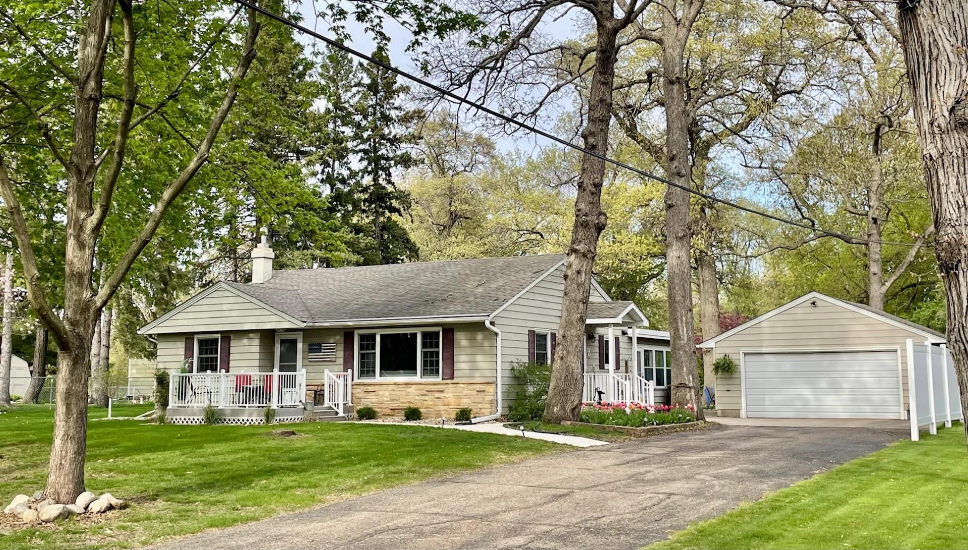 Front of home, nestled on a large lot