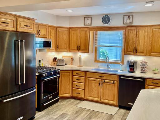Custom kitchen with oak cabinets and quartz countertops