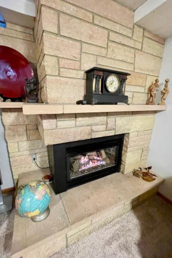 Classic stonework and gas fireplace in rec-room