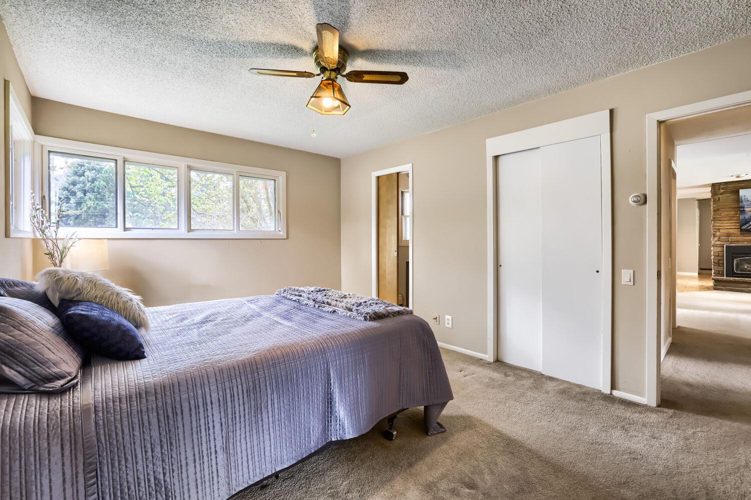 primary bedroom with private 3/4 bathroom