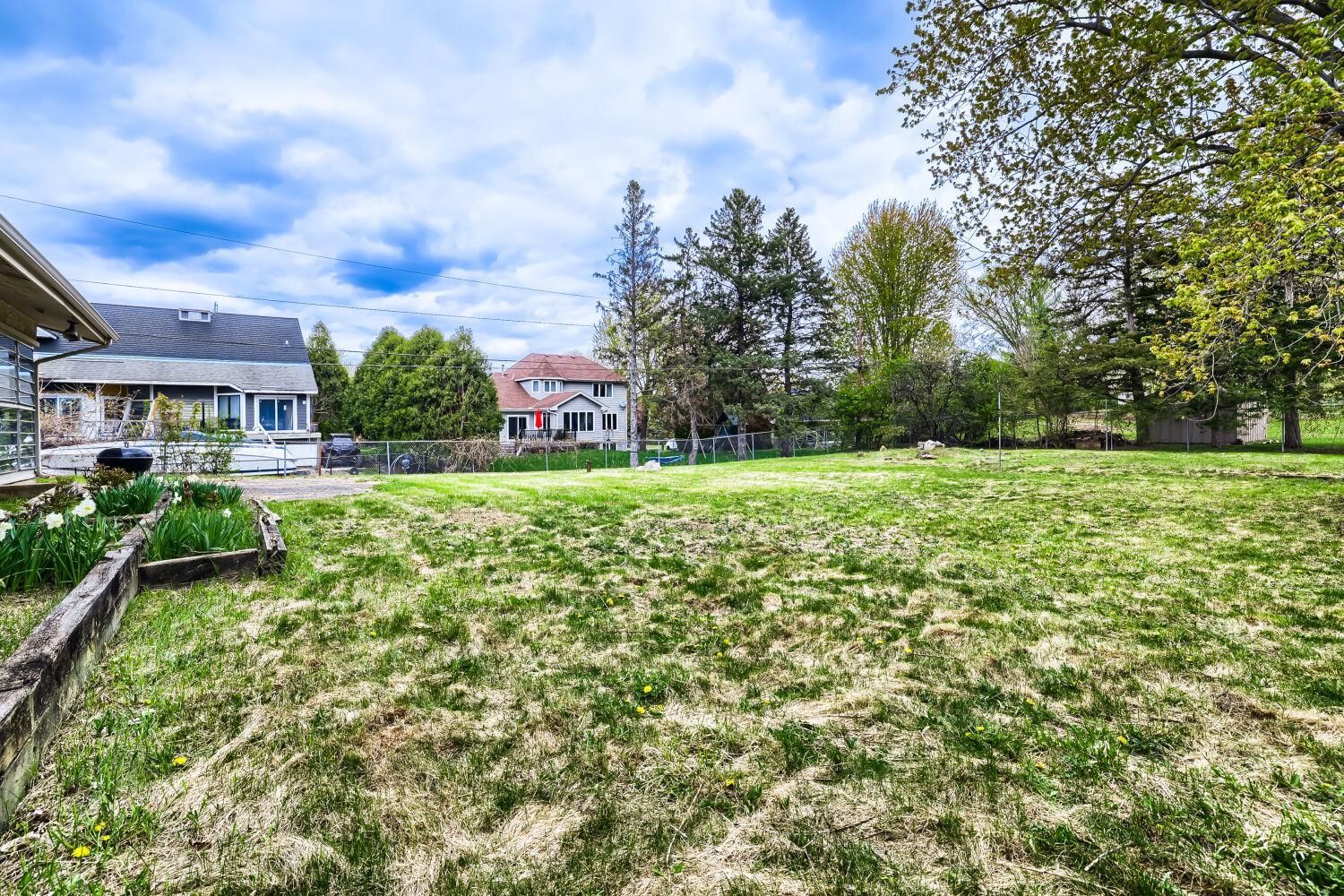 Spacious fenced in back yard for games and gardening.