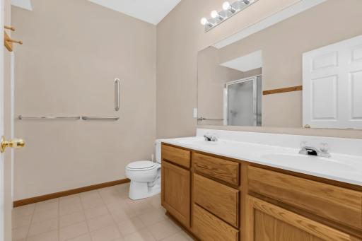 3/4 private ensuite bath w/ dual sink vanity