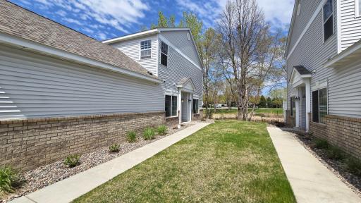 In demand end unit with green space and pond views