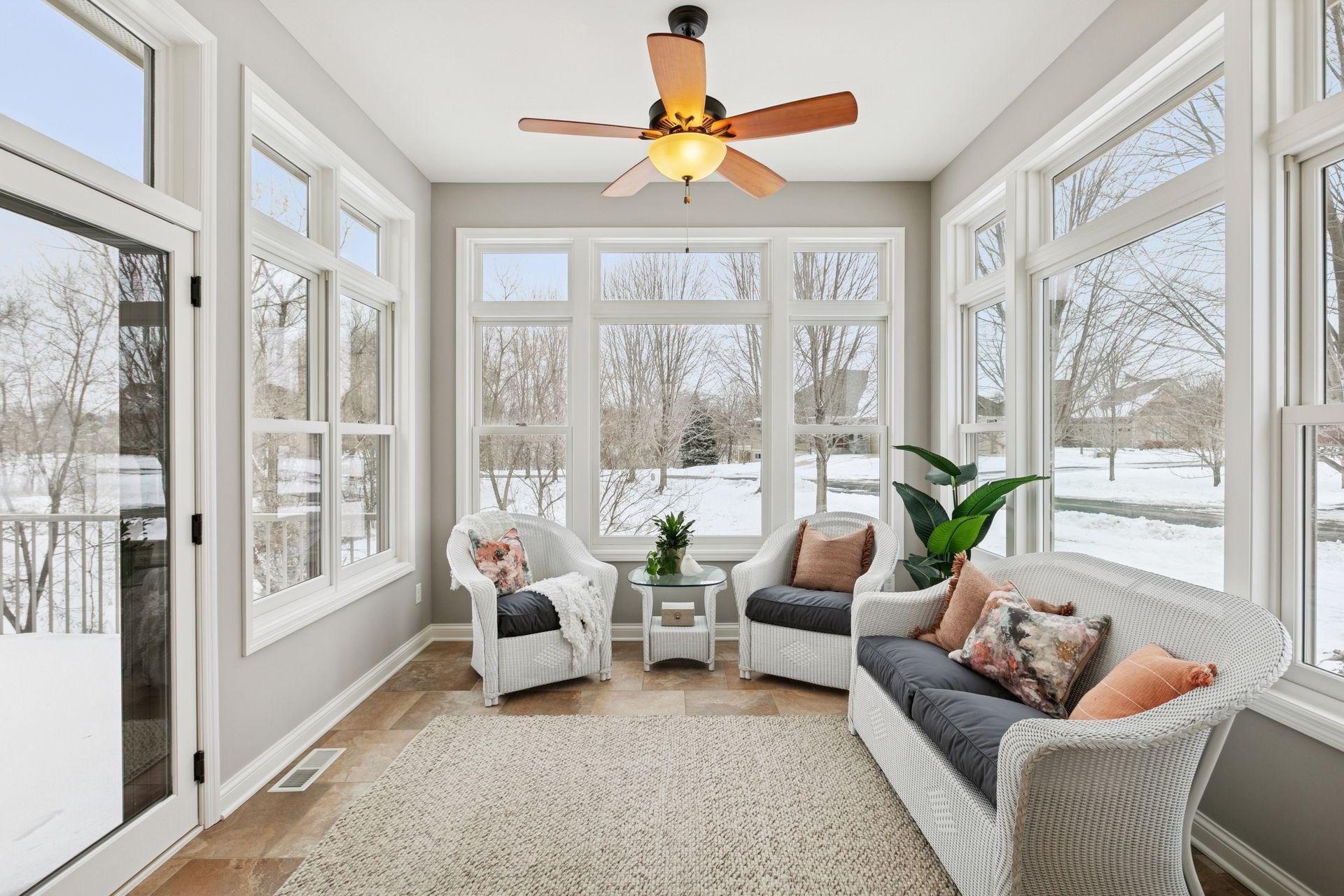 Light drenched sunroom has tiled floor with infloor heat