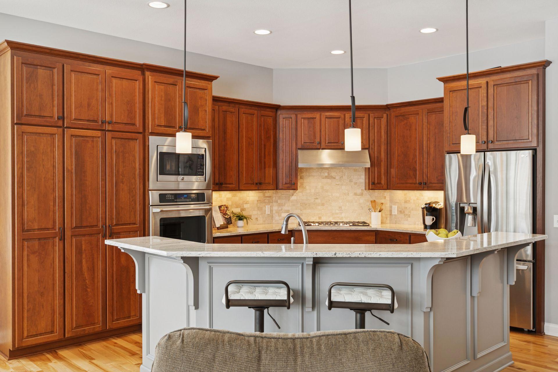 Kitchen with large center island and granite countertops