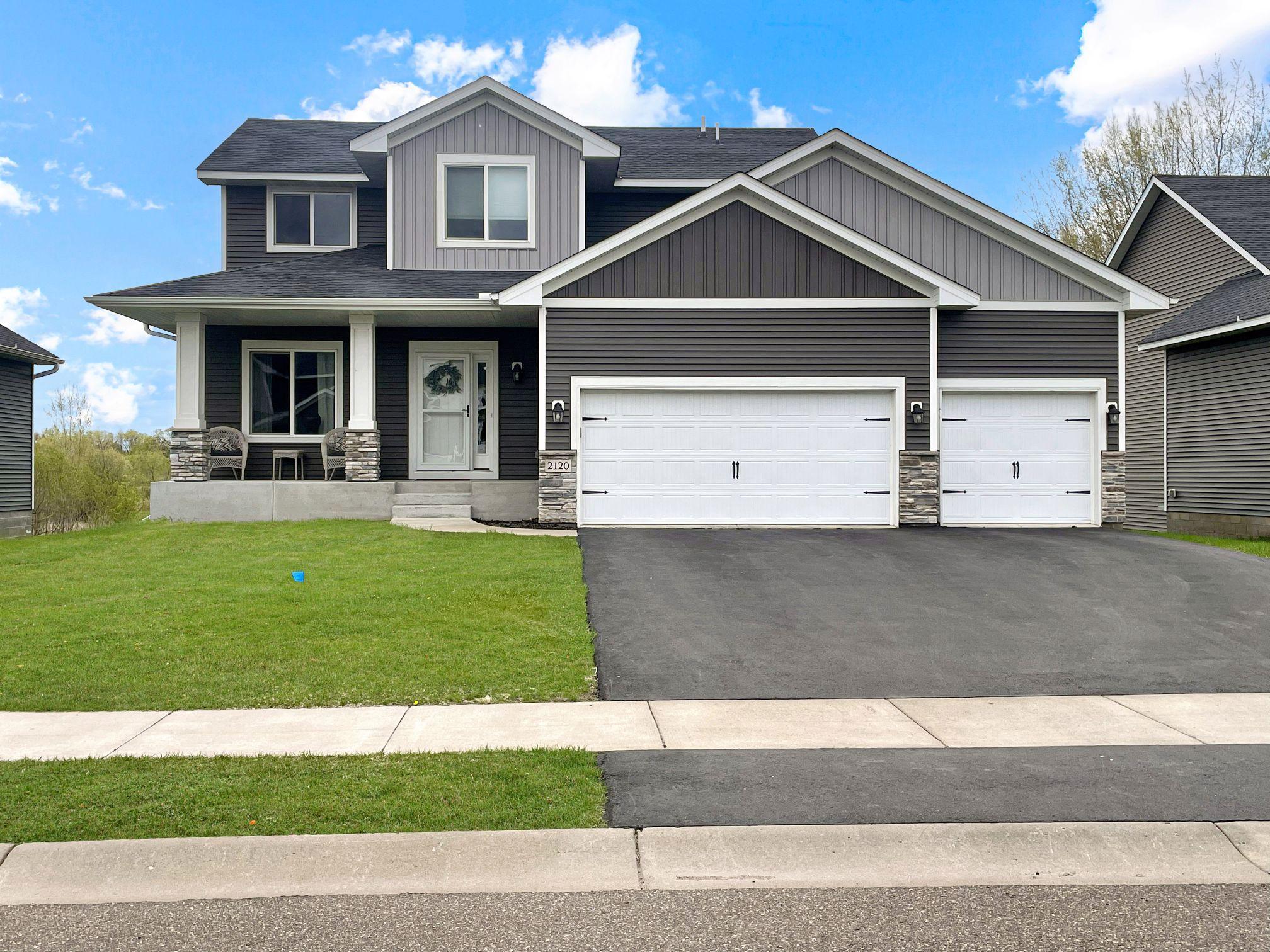 The 3-car insulated and heated garage with overhead storage adds practicality year-round