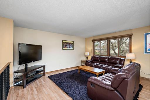 The living room has lots of space for furniture arrangements!
