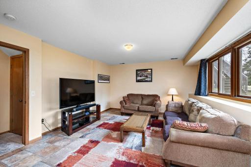 The extra large lower level family room has full size windows.
