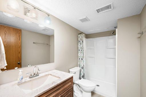The lower level bath is bright and cheery.