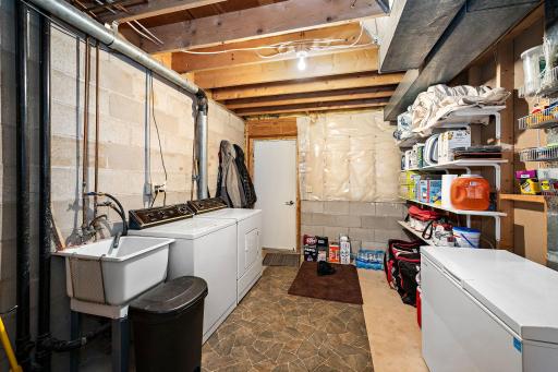 The laundry room has extra storage space and walks out to the attached garage!!