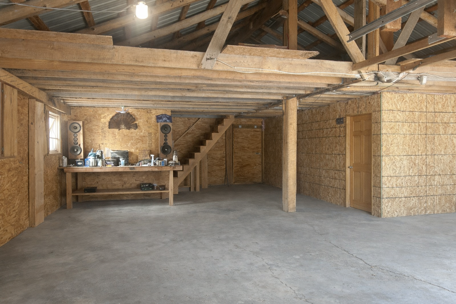 Garage stall and view of upper loft
