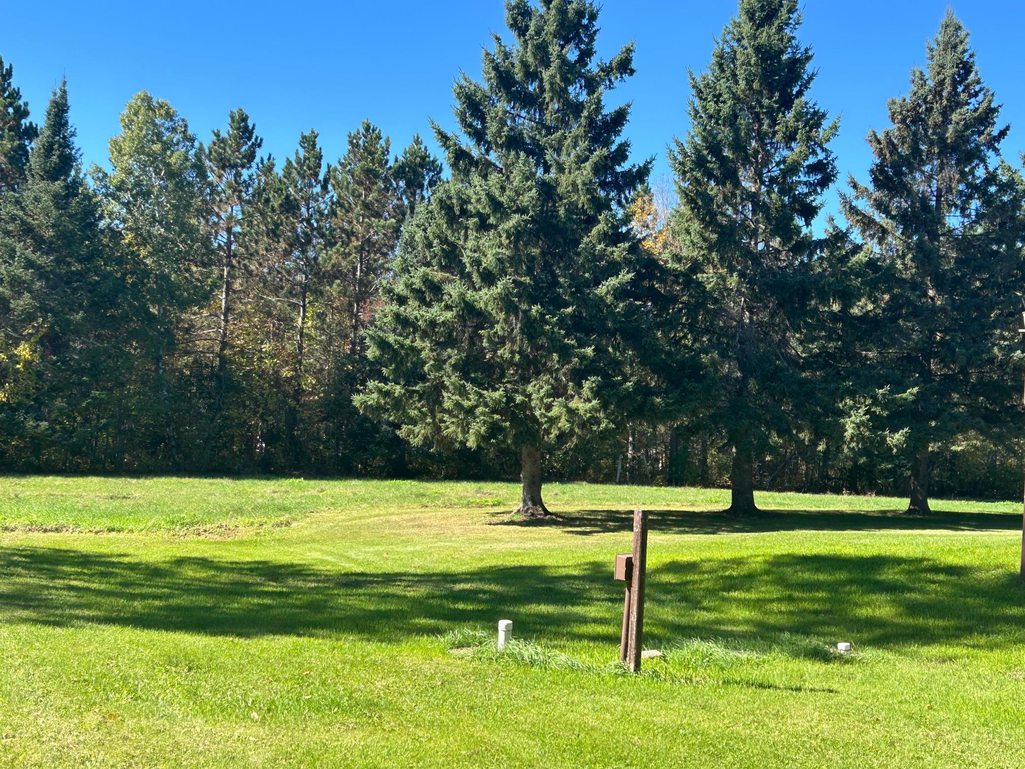 Acreage on side of house