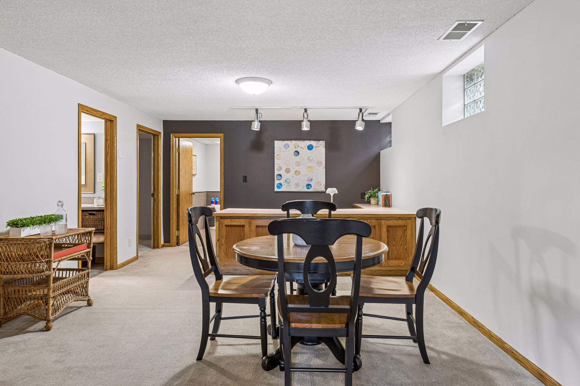 Family room provides enough space for a table to eat at. Built-in can serve as a buffet. If you work from home you can use the built-in for your desk, and the table could serve as a space to meet with clients.