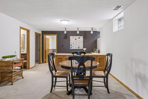 Family room provides enough space for a table to eat at. Built-in can serve as a buffet. If you work from home you can use the built-in for your desk, and the table could serve as a space to meet with clients.