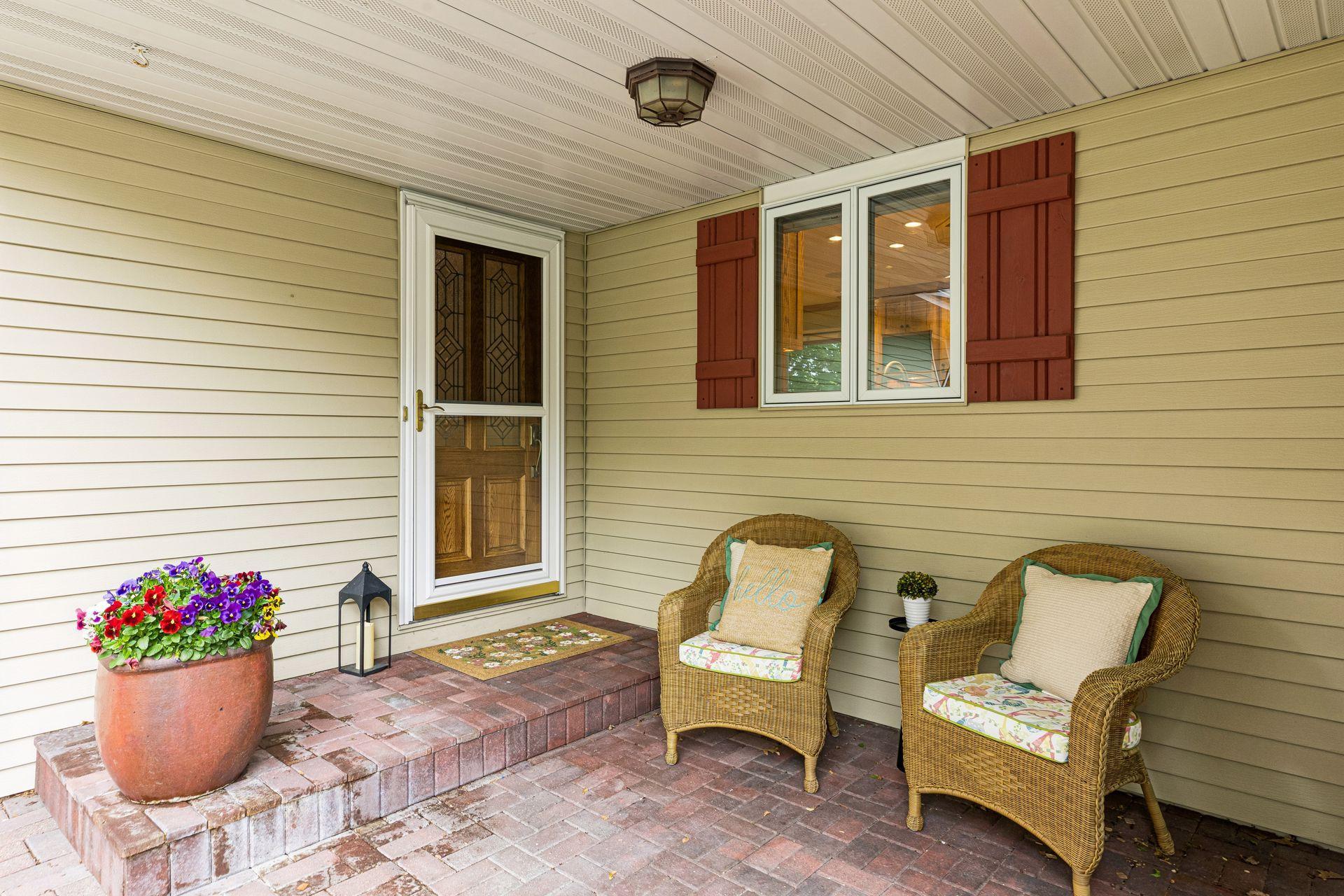 Inviting front paver porch welcomes you in.