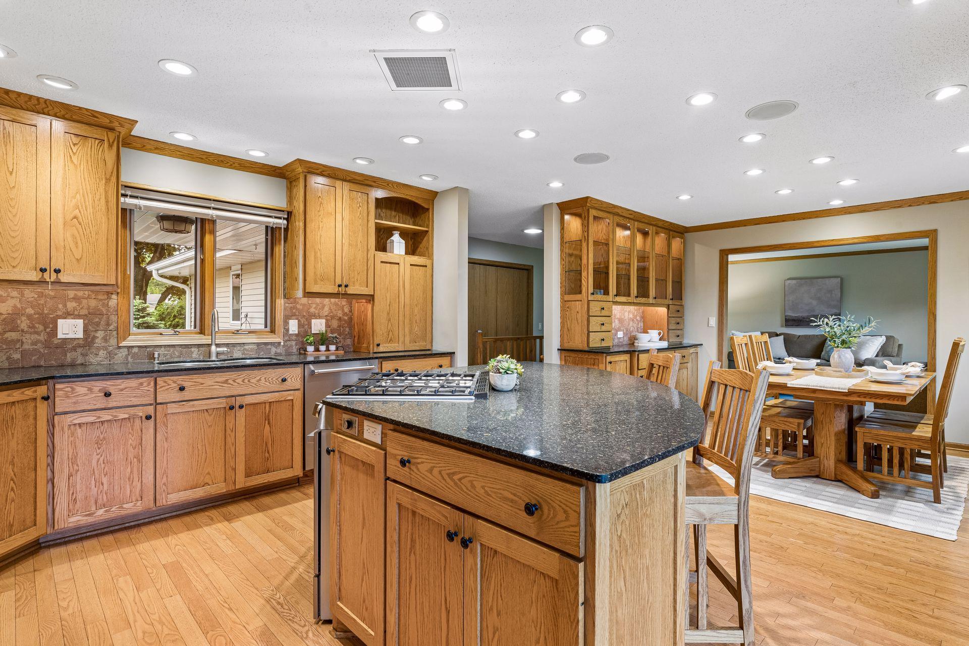 The large center island with granite counters is a great space for breakfast, snacks, and serving the kiddos.